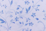 Light, printed off white linen fabric with light blue small flowers